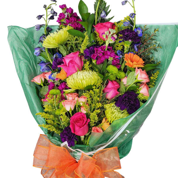 Colorful mixed bouquet wrapped in green paper with an orange bow