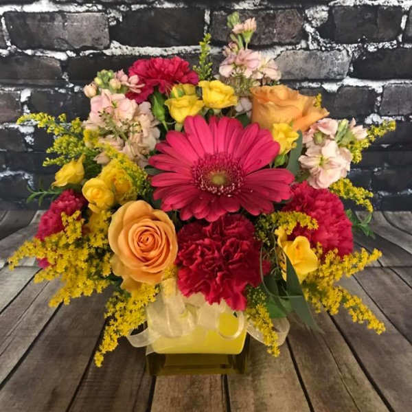 Colorful mixed flower bouquet with roses, gerbera daisies, and carnations