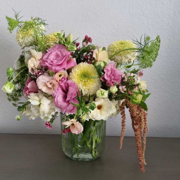 Pink and white mixed bouquet in a clear glass vase