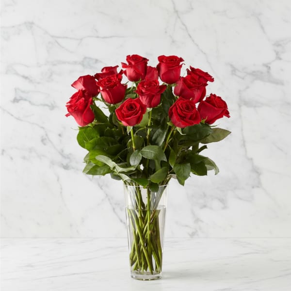 Bouquet of red roses in a clear glass vase