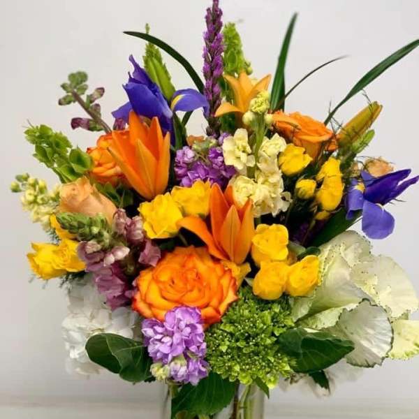 Colorful mixed bouquet in a clear glass vase