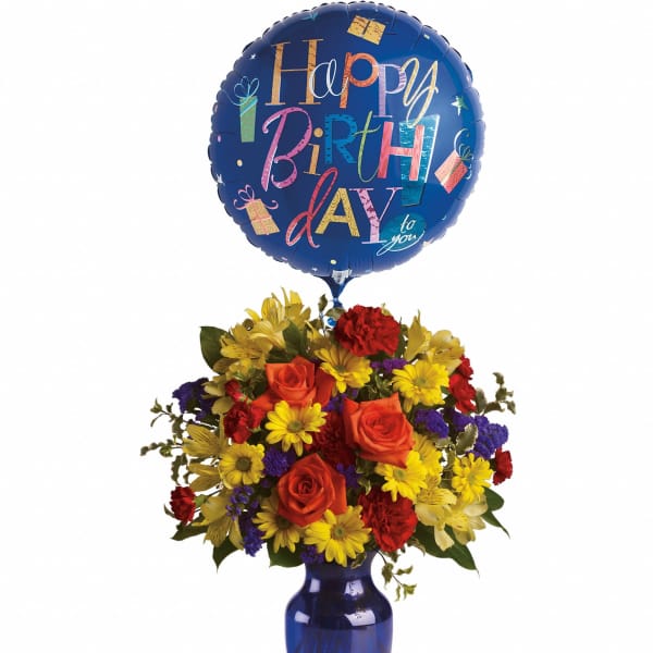 Birthday balloon above a colorful mixed flower bouquet in a blue vase