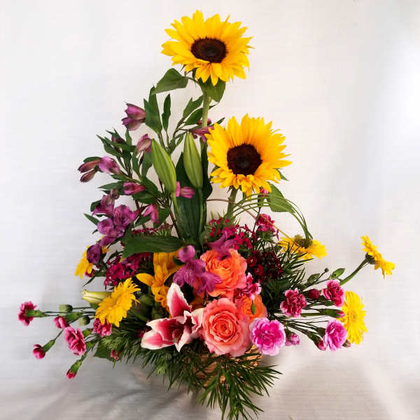 Tall bouquet with sunflowers, roses, lilies, and pink alstroemeria