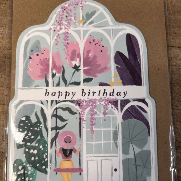 Happy birthday greeting card with greenhouse and woman on a swing illustration