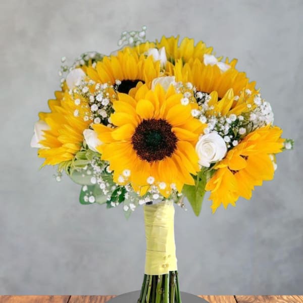 Bouquet of yellow sunflowers with white accent flowers