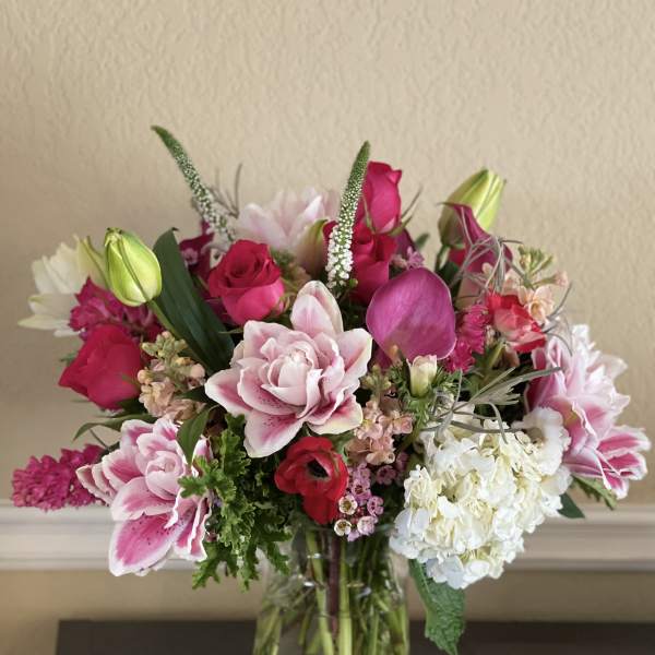 Pink and white mixed bouquet in a clear glass vase