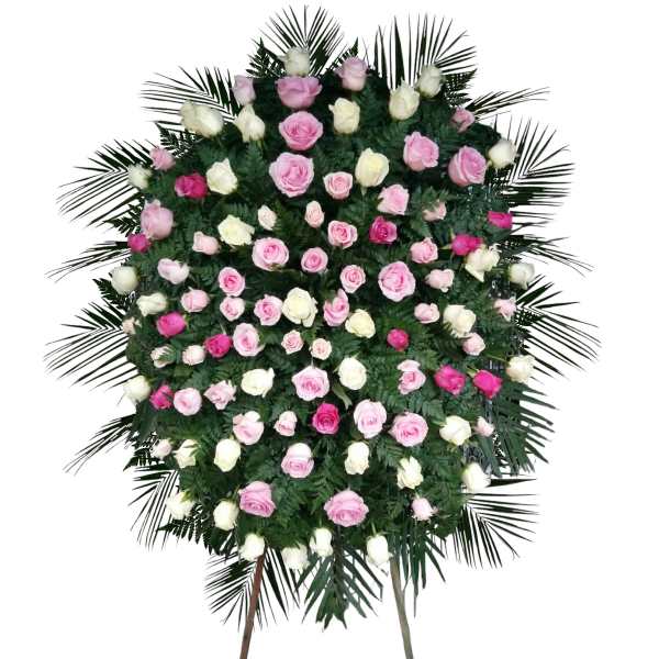Standing floral spray of pink and white roses on a white background