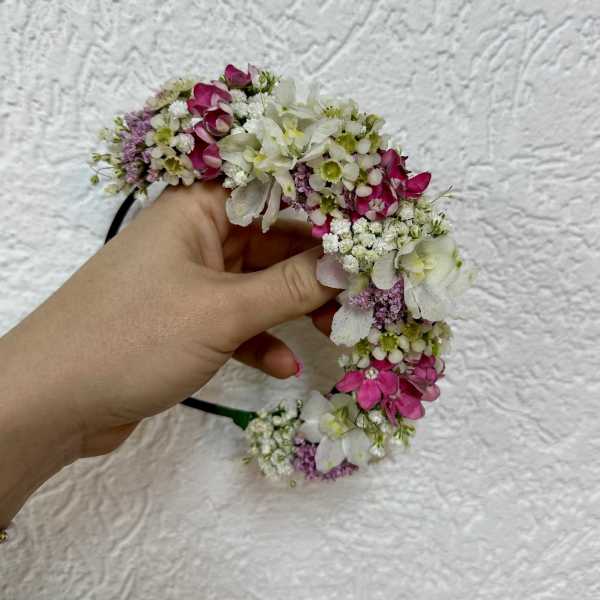 Handheld floral crown with pink and white blossoms