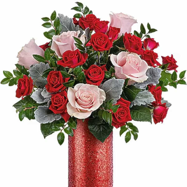 Red and pale pink roses in a glittery red vase