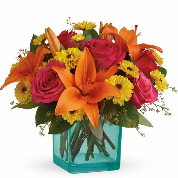 Orange lilies and pink roses in a turquoise vase