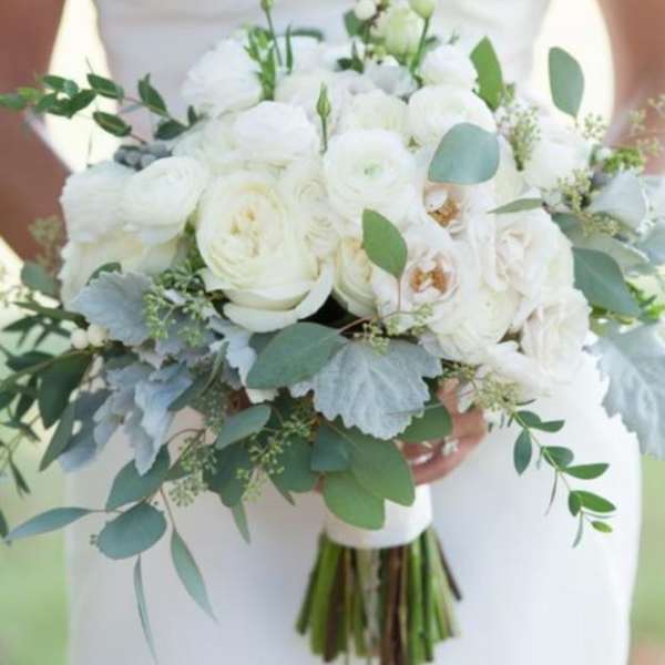 White bridal bouquet with eucalyptus and pale blue foliage