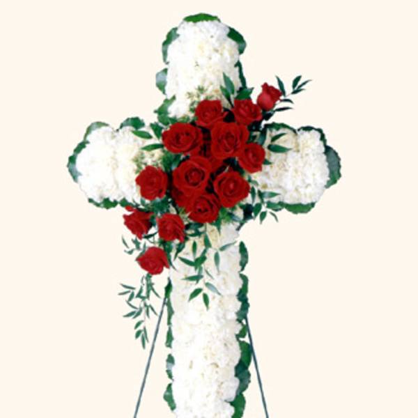 Standing floral cross with white flowers and red roses