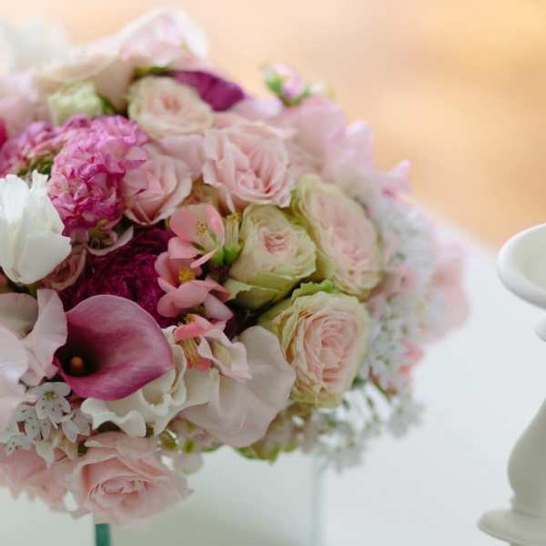 Pink and white rose bouquet with a purple calla lily