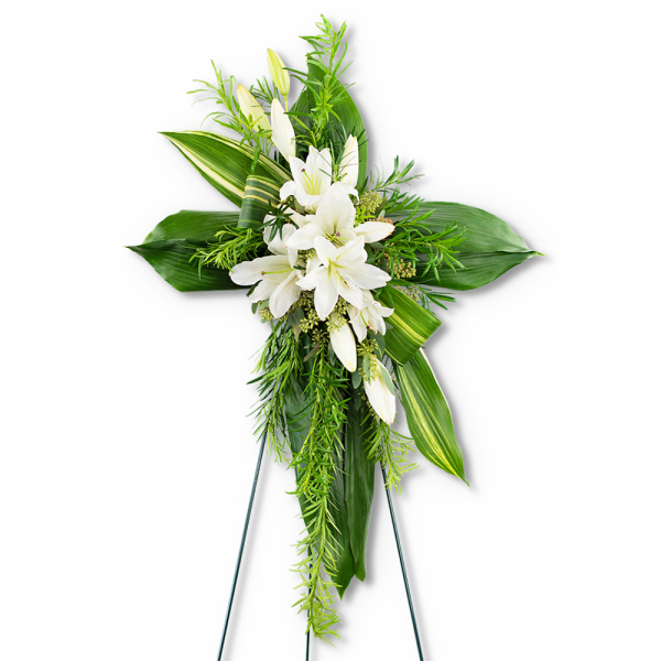 White lilies and greenery arranged on a standing easel