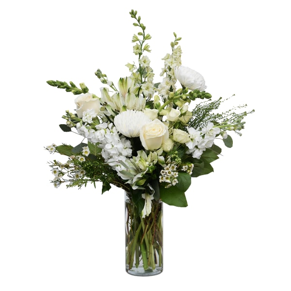 White floral arrangement in a clear glass vase