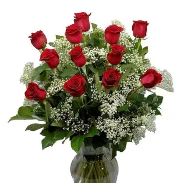 Red roses and baby's breath in a glass vase