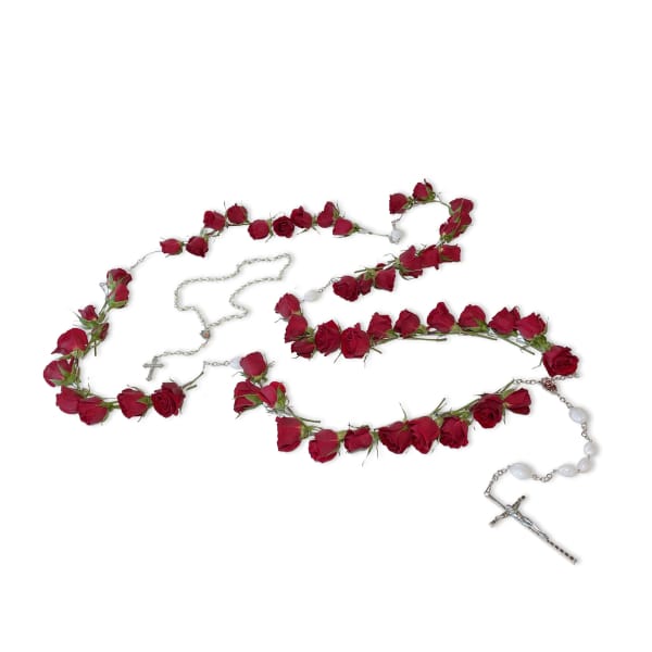 Rosary necklaces decorated with red roses on a white background