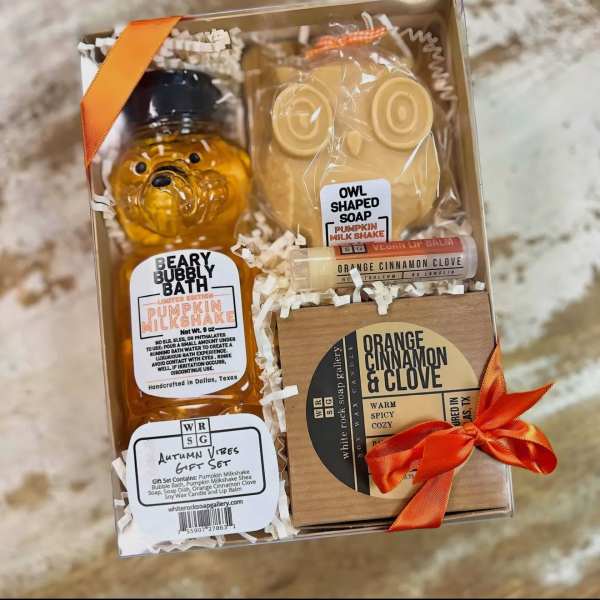 Autumn-themed gift set with soap, lip balm, and candle in a box