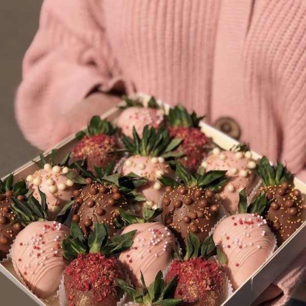 Box of chocolate-covered strawberries in pink and brown coatings