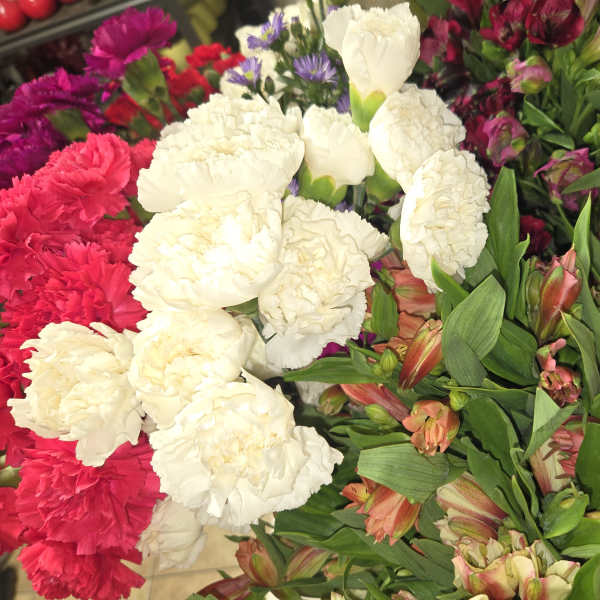 Mixed bouquet of white and pink carnations with pink alstroemeria