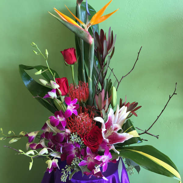 Tall tropical bouquet with bird of paradise, roses, orchids, and lilies
