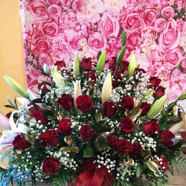 Large bouquet of red roses and white lilies with baby's breath