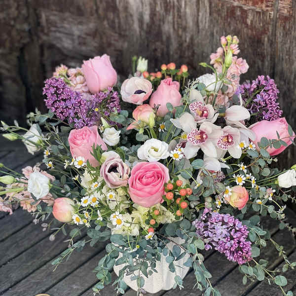 Pink and white mixed bouquet in a white vase