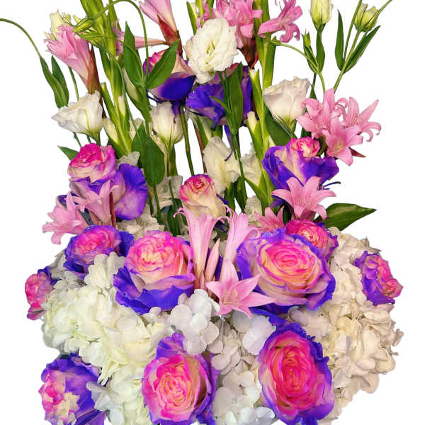 Tall bouquet of pink and white flowers with purple-tipped roses