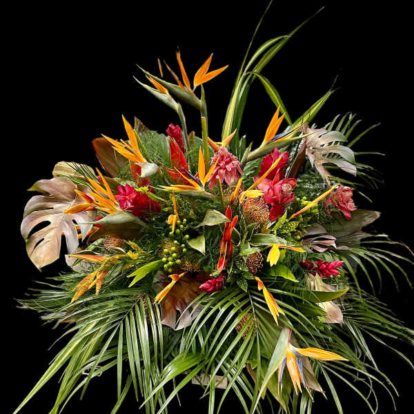 Tropical bouquet with orange bird-of-paradise and red flowers