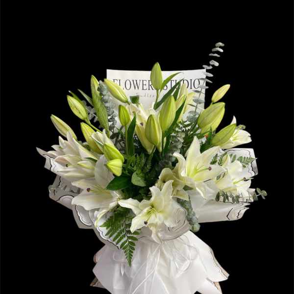 White lily bouquet with green buds and a white ribbon wrap