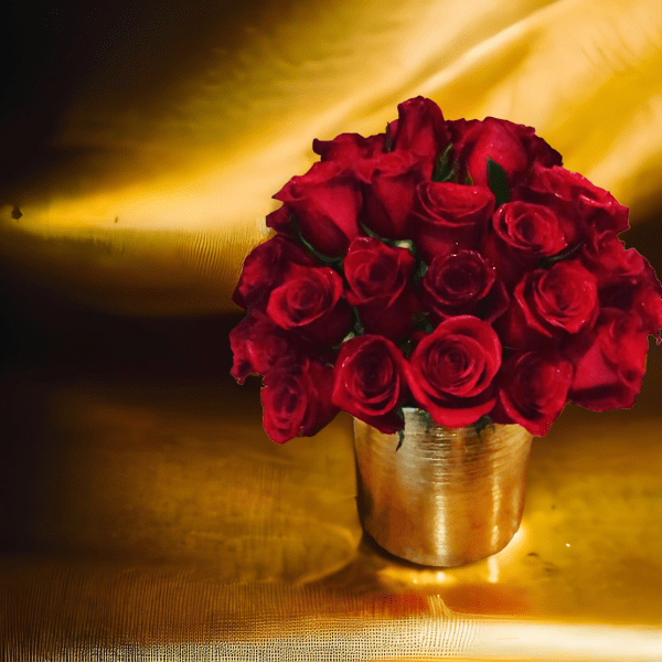 Red roses arranged in a gold vase
