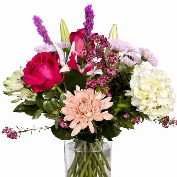 Mixed pink and white bouquet in a clear glass vase