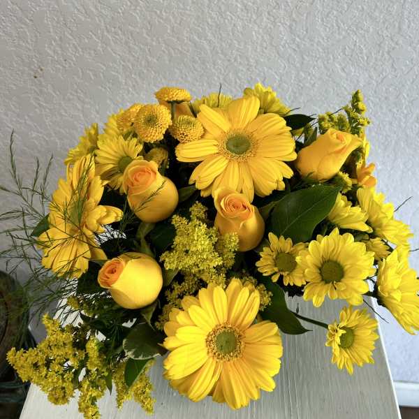 Yellow bouquet with gerbera daisies, roses, and small filler flowers