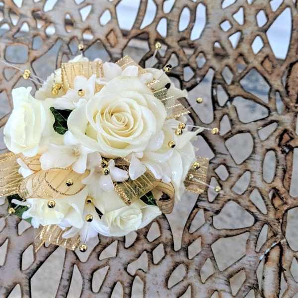 White rose bouquet with gold ribbon and bead accents