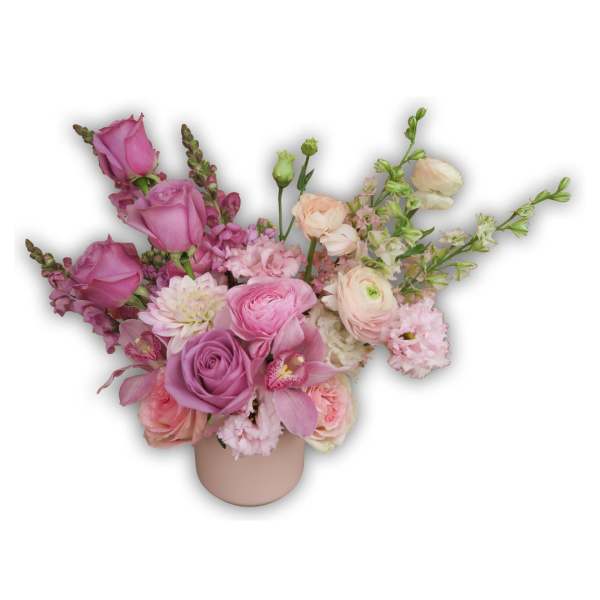 Pink and lavender mixed bouquet in a blush vase