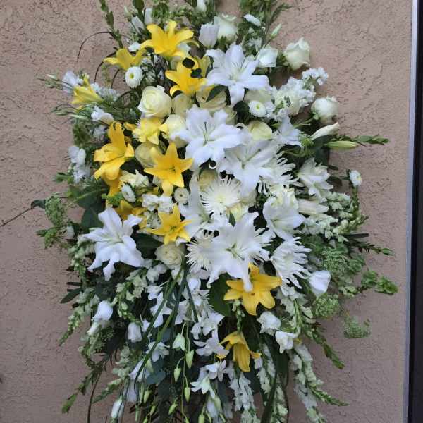 Large standing spray of white and yellow flowers