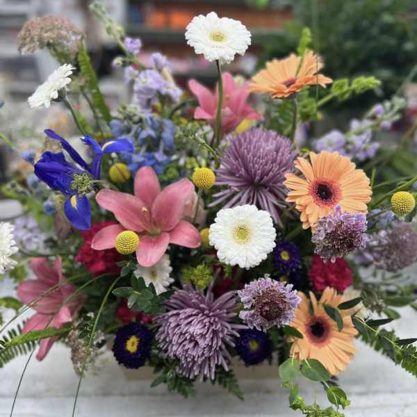 Colorful mixed bouquet with gerbera daisies, lilies, and chrysanthemums