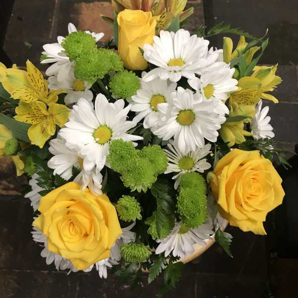 Bouquet of yellow roses, white daisies, and green pompons