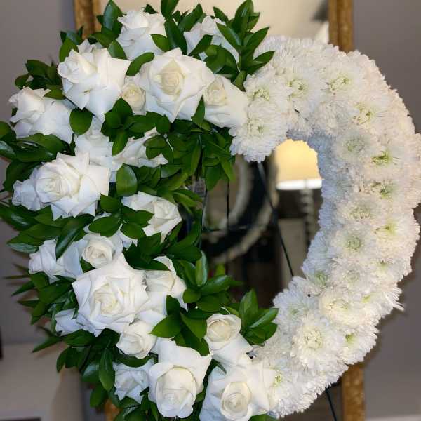 Heart-shaped white rose and chrysanthemum floral arrangement