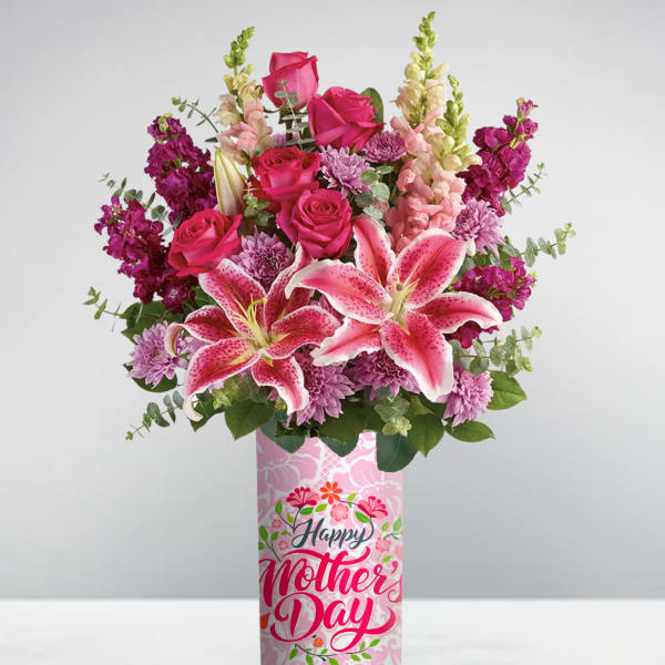 Tall pink Mother’s Day vase with pink lilies, roses, snapdragons, and mums