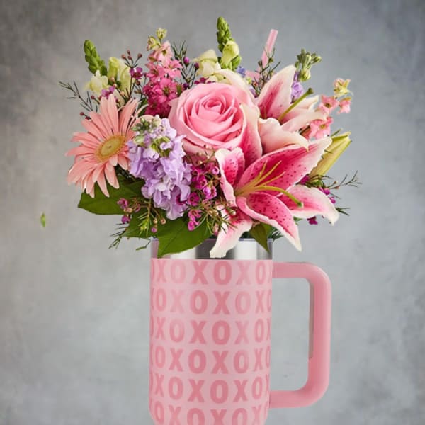 Pink and lavender bouquet in a pink XOXO tumbler vase