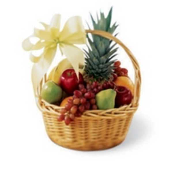 Fruit basket with a pineapple, apples, grapes, and a ribbon bow