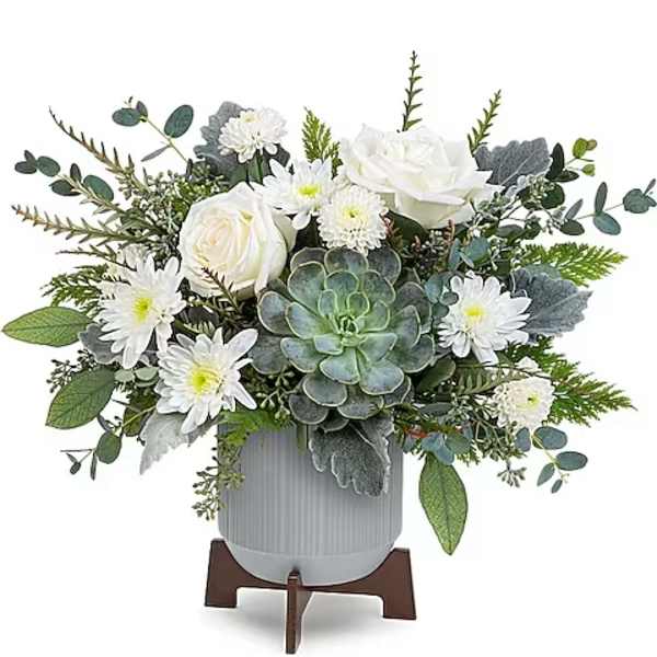 White roses and daisies in a gray vase with a succulent centerpiece
