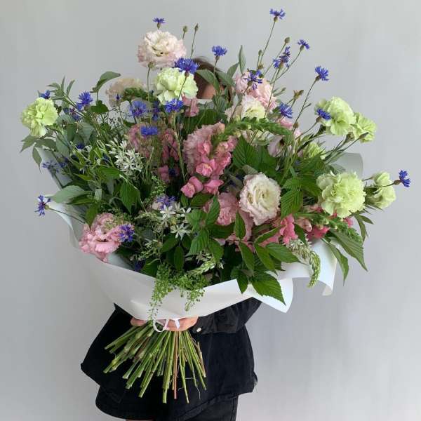 Large bouquet of pink and white flowers with blue accents