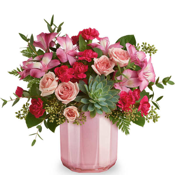 Pink roses and carnations in a pink glass vase
