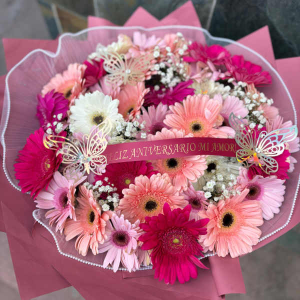 Pink and white gerbera daisy bouquet with a anniversary ribbon