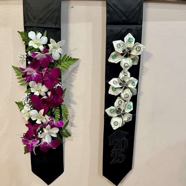 Two black graduation stoles, one with orchids and one with folded money flowers