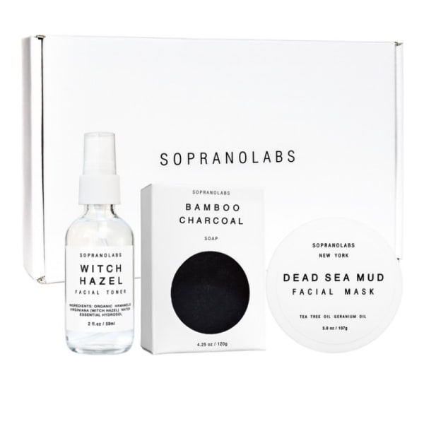 Skincare gift set with toner, soap, and facial mask in white packaging
