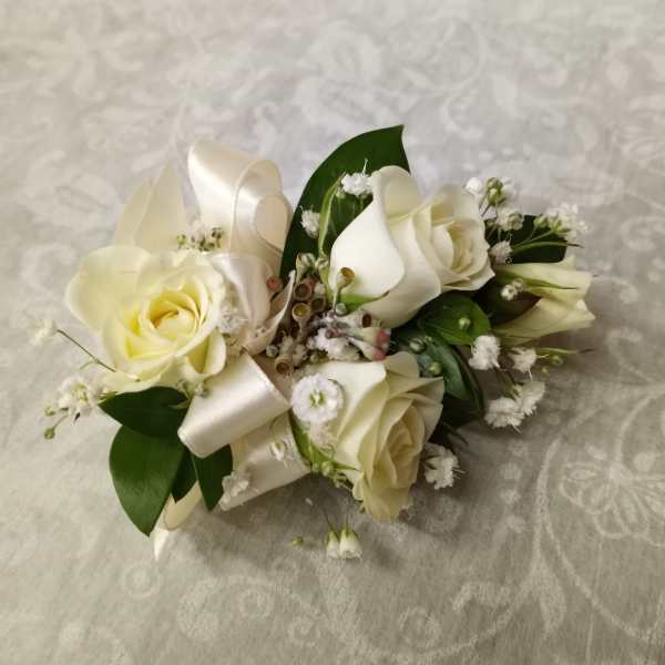 Cream rose bouquet with white ribbon and small white filler flowers