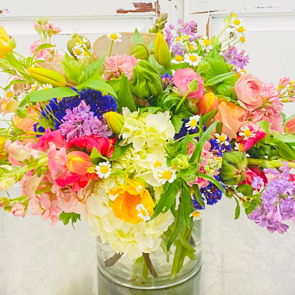 Colorful mixed bouquet in a clear glass vase